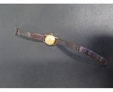 An 18ct yellow gold ladies Damas manual wind wristwatch - Width 18mm including button - working in the saleroom, some stainin