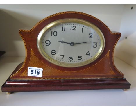 An Edwardian mahogany and inlaid mantle clock 