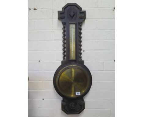 An oak barley twist aneroid barmoeter with thermometer - 80cm tall 
