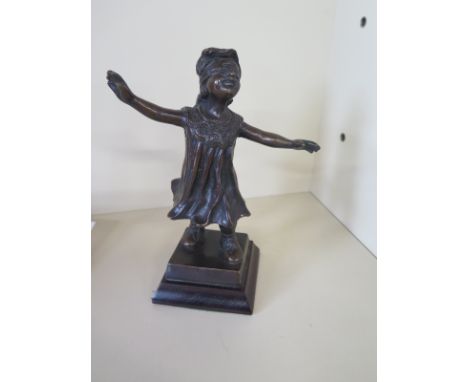 A bronze figure of a girl playing blind mans bluff - Height 20cm - in good condition 