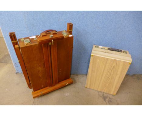 An artist's paint box and folding easel