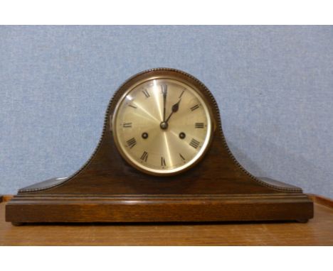 An oak mantel clock