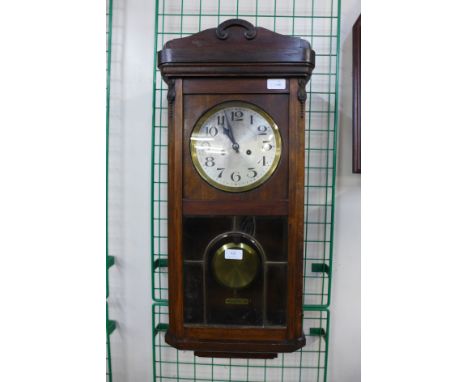 An oak wall clock