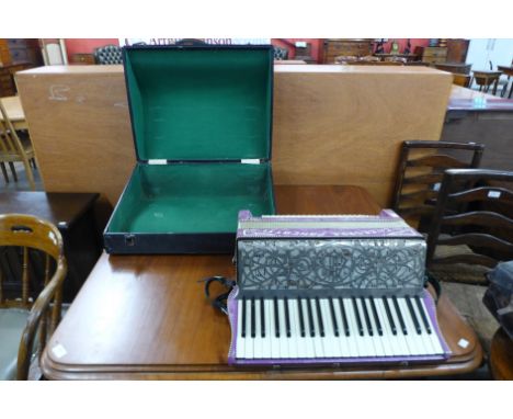An Italian Cav. Cesare Pancotti accordion with case