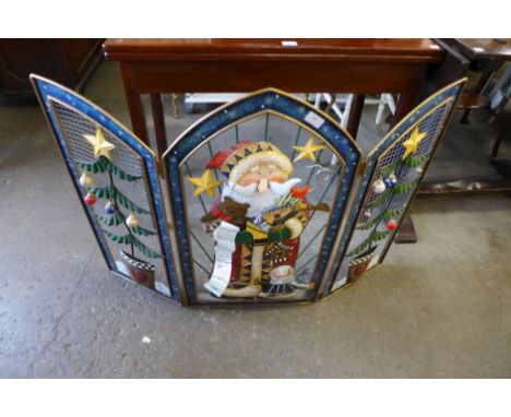 A Christmas themed firescreen
