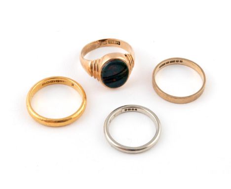 A BLOODSTONE AND GOLD SIGNET RING the oval-shaped bloodstone is set in yellow gold, size M 1/2, together with a 22ct gold wed