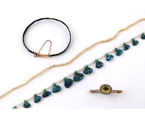 A CITRINE AND SEED PEARL CLUSTER BROOCH mounted with an oval-shaped citrine within a surround of seed pearls, in gold, togeth