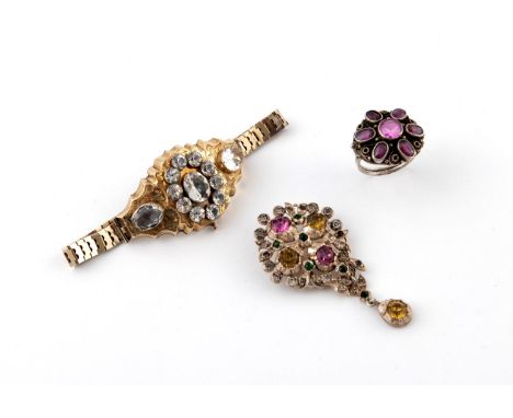 A PASTE SET BROOCH of foliate form, mounted with white, pink, yellow and green paste stones, 5.5cm long, together with a past