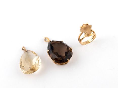 A SMOKY QUARTZ PENDANT the pear-shaped smoky quartz is set in yellow gold, 3cm long, together with a citrine pear-shaped brio