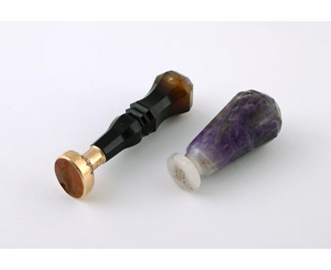 AN AMETHYST STONE SEAL engraved with initials to the matrix, 6cm long, together with a quartz and gold seal, the carnelian ma