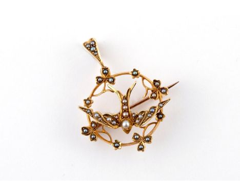 A VICTORIAN 15CT GOLD AND PEARL SET SWALLOW BROOCH PENDANT set overall with graduated half pearls, 3cm dia