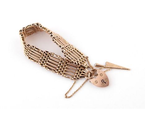 A 9CT GOLD GATE LINK BRACELET with padlock clasp, and suspending a dagger charm, 16cm long, 24.1 grams