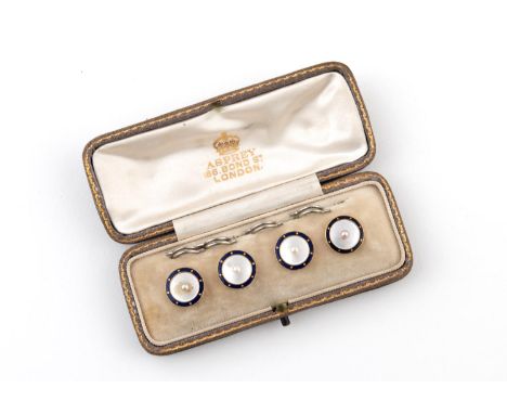 A SET OF FOUR ENAMEL AND MOTHER-OF-PEARL DRESS BUTTONS each mother of pearl disc centred with a small pearl within a surround