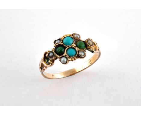 A TURQUOISE AND PEARL SET RING mounted with circular turquoise cabochons and small pearls, in gold. Size O