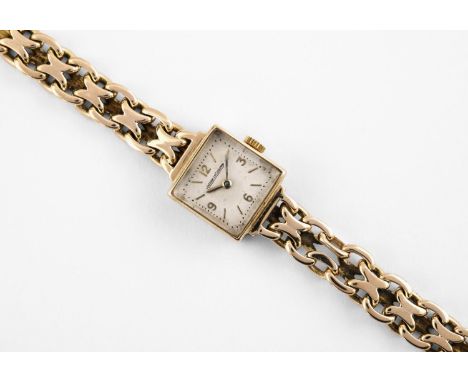 A LADY'S 9CT GOLD WRISTWATCH BY JAEGER-LeCOULTRE the signed square-shaped dial with Arabic quarters and baton numerals, with 