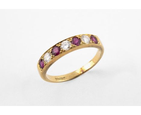 A RUBY AND DIAMOND HALF HOOP RING set with four circular-cut rubies and three circular-cut diamonds, in 18ct yellow gold. Siz