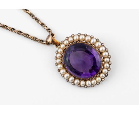 AN AMETHYST AND PEARL CLUSTER PENDANT the large oval-shaped amethyst is set within a surround of half pearls, in gold, 3.5cm 