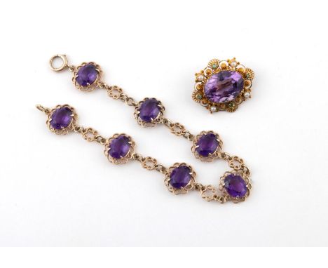 AN AMETHYST AND 9CT GOLD BRACELET formed with seven oval-shaped amethysts in gold openwork mounts, 18cm long, 11.8 grams, tog