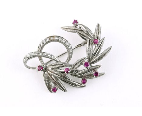 A RUBY AND DIAMOND FOLIATE SPRAY BROOCH mounted with circular-cut rubies and circular-cut diamonds in 18ct white gold, 4cm lo