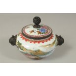 A CHINESE ENAMELLED TWIN HANDLE CENSER AND COVER, painted with a landscape scene as well as flora