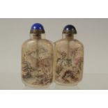 A CHINESE REVERSE GLASS PAINTED DOUBLE-SNUFF BOTTLE AND STOPPERS, finely painted with a landscape