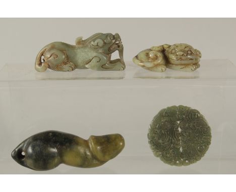 A COLLECTION OF FOUR CHINESE CARVED JADE PIECES, (4).