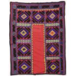AN UZBEK SUZANI EMBROIDERED TEXTILE, with diamond motifs in purple, yellow, green, blue, black,