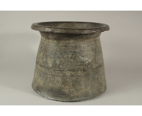 A RARE AND LARGE 17TH CENTURY OTTOMAN TURKISH ENGRAVED COPPER PLANTER BASIN, depicting tulip designs, 25cm high, 29cm diamete