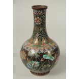 A CHINESE BLACK GROUND CLOISONNE FLORAL VASE, 25cm high.