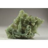 A LARGE CHINESE CARVED JADE GROUP DEPICTING FIGURES ON A BOAT, with a dragon and back-panel of trees