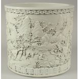 A VERY LARGE CHINESE DEHUA PORCELAIN BRUSH POT, relief-decorated with an expansive landscape: