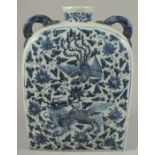 A VERY LARGE CHINESE BLUE AND WHITE PORCELAIN WATER FLASK, with double-twin handles and painted with