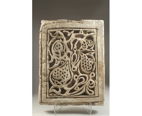 A FINE AND LARGE 17TH CENTURY MUGHAL INDIAN CARVED STONE ARCHITECTURAL PANEL, with foliate motif decorative carving, 54cm x 4