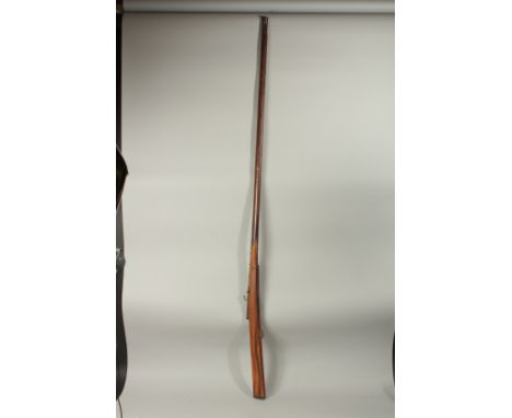 A LONG INDIAN MATCHLOCK RIFLE, 186cm long.