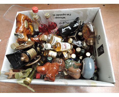 A large collection of Blended Whisky Miniatures, other Spirits, Ceramic Ornaments including Rutherfords Highland Bulls, Beswi