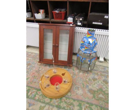A glass lantern, display case and a wooden pipe holder with glass pipes&nbsp;