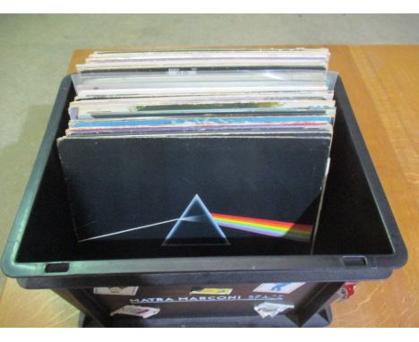 A  collection of 12" vinyl records including Pink Floyd, Queen, The Eagles, The Beatles, The Moody Blues, Meat Loaf, The Poli