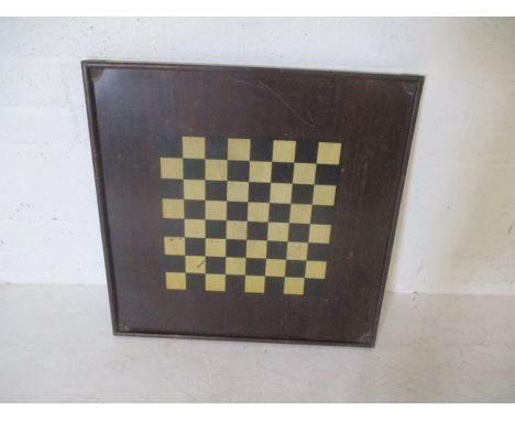 A large wooden table top chess board