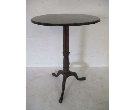 A mahogany tripod occasional table on tripod legs