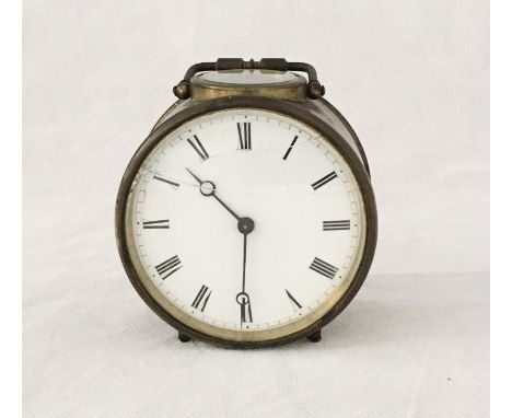 A brass alarm clock marked KB - glass cracked but no damage to dial