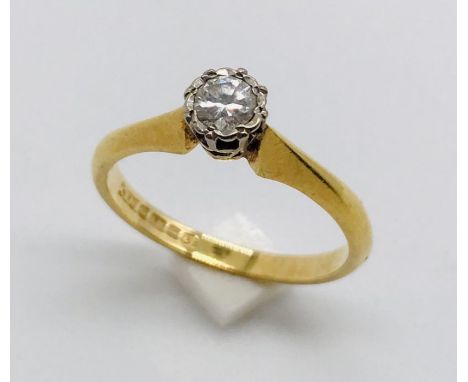 A diamond solitaire ring set in 18ct gold