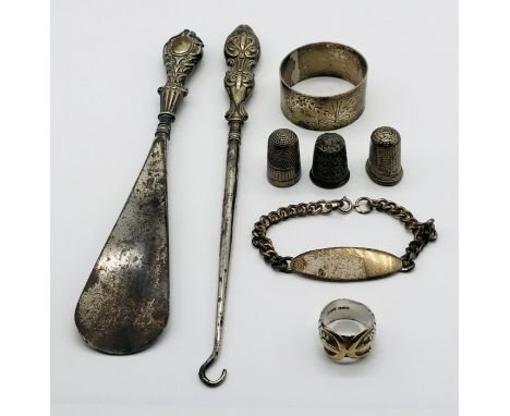 A collection of hallmarked silver items including thimbles, serviette ring, bracelet etc.