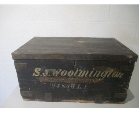 A vintage metal bound wooden trunk. Painted inscription to front reads S J Woolmington 2/4 Som L I (2/4 Battalion, Somerset L