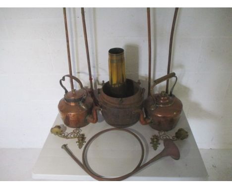 A assortment of Copper and brass items, including Hunting Horns, Kettles, a Shell, Candlesticks etc