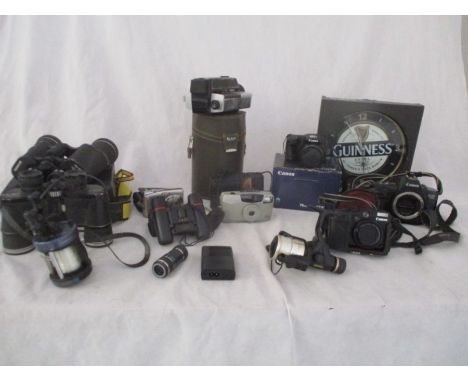 A collection of camera, binoculars, and fishing reels including Canon, Kodak Ektar, Bell &amp; Howell, Tasco etc.