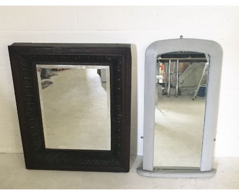 A large carved wooden mirror along with one other