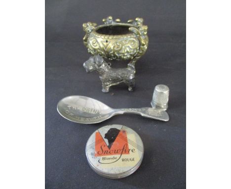 A small brass dish ( A/F) along with a metal model of a dog, "Snowfire Blonde Rouge" and a caddy spoon advertising Wilson's P