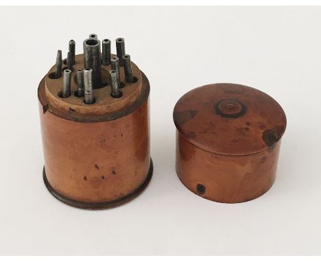 A Watchmakers set of tools in treen case, height 6.5cm