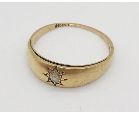 A worn 18ct gold ring set with a single diamond, weight 2.9g