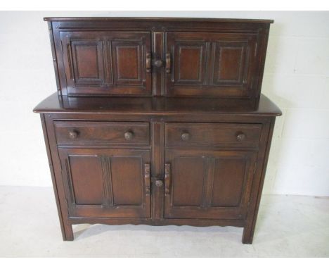 An Ercol dark wood Court Cupboard/ sideboard